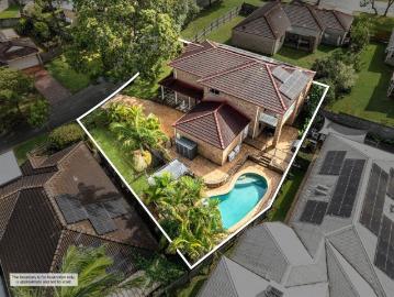 Resort Style Family Living in a Premier Forest Lake Pocket