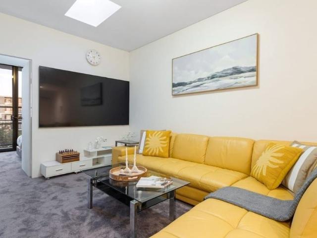 Resort Style Furnished Living with Sunlit Spaces and Serene Garden Views