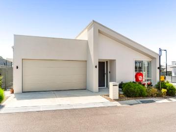 Resort Style Living in a Beautifully Designed McDonald Jones Home
