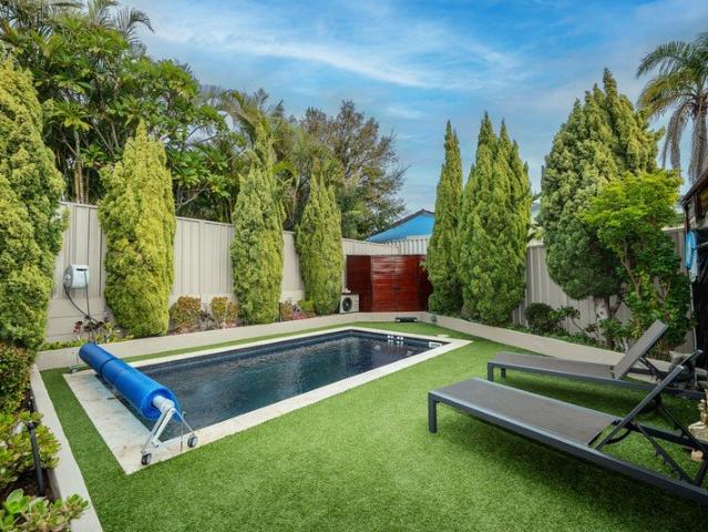 RESORT STYLE LIVING IN A FULLY RENOVATED FAMILY ENTERTAINER