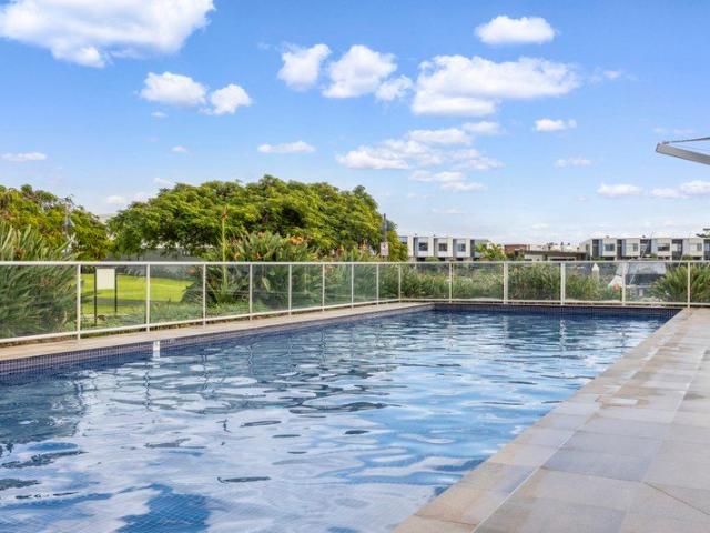 Resort Style Living with Home Office & Serene Water Outlook in Prestigious Cova Estate