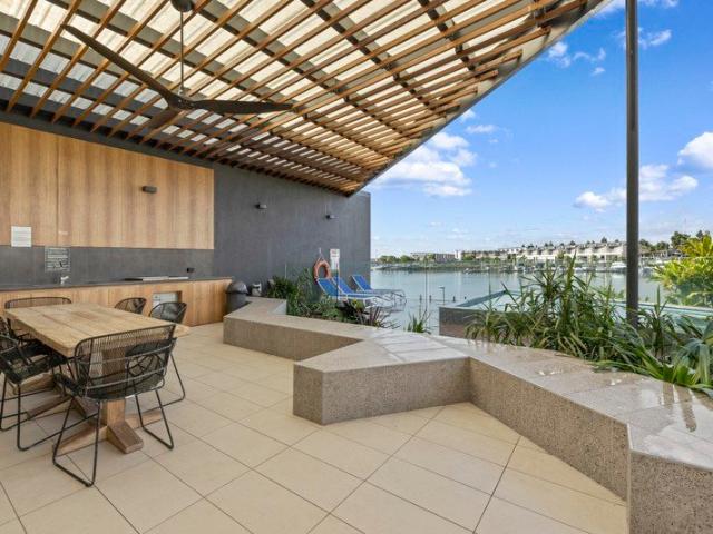 Resort Style Living with Home Office & Serene Water Outlook in Prestigious Cova Estate
