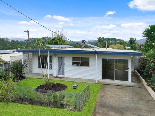 Retro Charm + Huge Potential in Heart of Village!