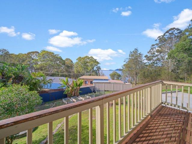 Retro lake view cottage moments from waters edge