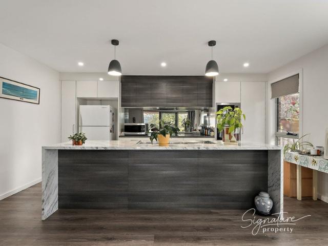 River Outlooks and Modern Ease on a LowMaintenance Block