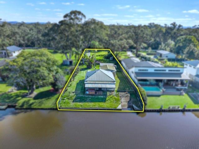 Riverfront Cottage with Private Boat Ramp & Endless Potential