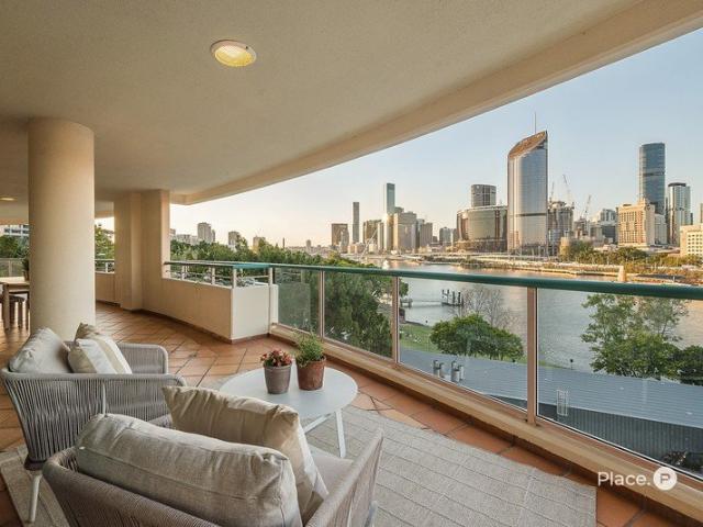 Riverfront Grandeur with City Views