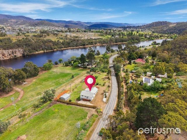 Riverside Living, Renovated Comfort & Room for the Future!