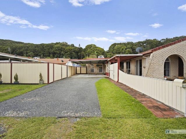 Riverside Living with Exceptional Parking & Lifestyle Appeal
