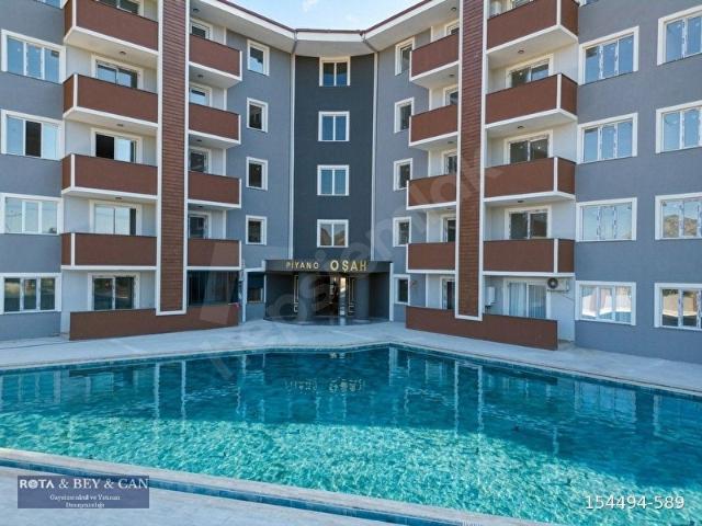 ROTA'DAN KAPALI OTOPARKLI 1+1 HAVUZLUMODERN KONSEPT DAİRE