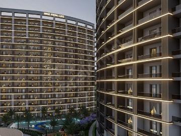 ROYAL EMLAKTAN TÖMÜKTE HAVUZLU SİTEDE FULL EŞYALI SATILIK 1+1