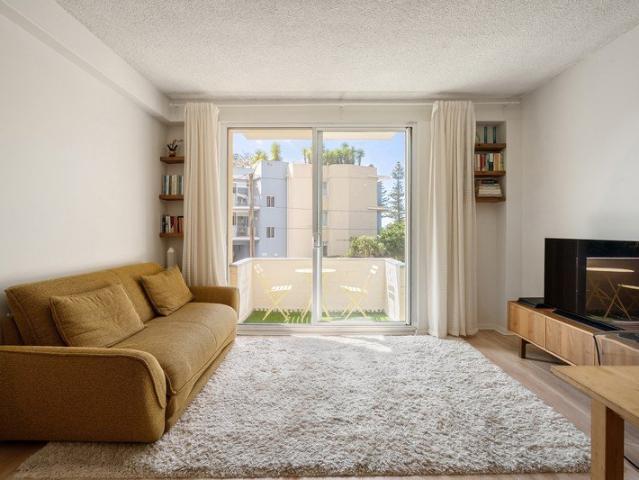 Sensational contemporary apartment with ocean views and three sunny balconies just footsteps from eateries and the beach