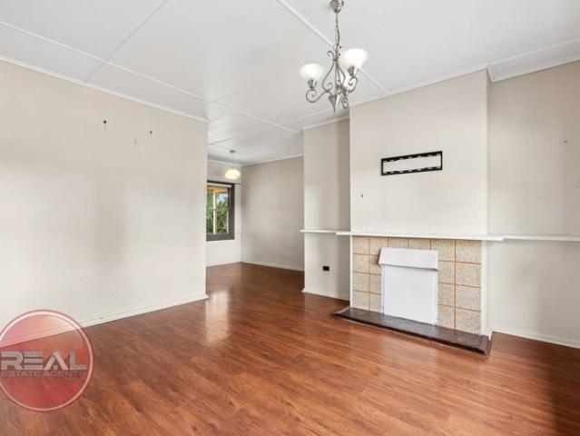 Secure 3 Bedroom Home on Large Block!