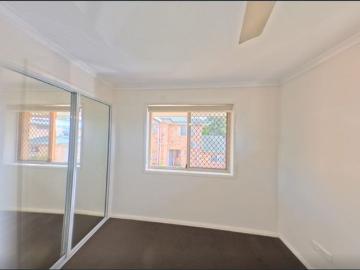 Secure 2BR Townhouse – Water Included & Walking distance to train, bus stations and shopping centers