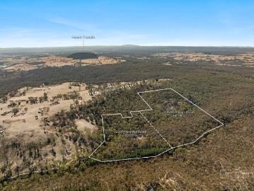Secluded 65 Acre Retreat with Breathtaking Views and Untapped Potential