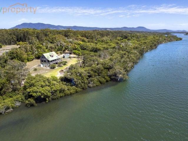 SECLUDED WATERFRONT ACRES