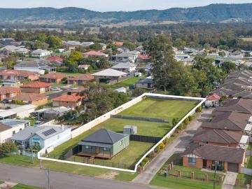 Serious Development Opportunity with Renovated 4 Bedder at Front