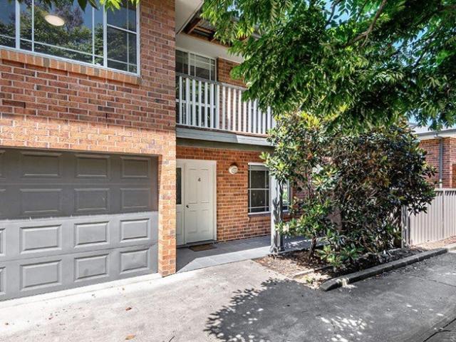 Set in a small complex in a popular downtown area is this low maintenance two bedroom townhouse conveniently close to the main street