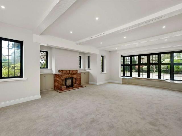 Set on a corner plot in a prime gated private estate, this lovely characterful five bedroom family home has been extensively refurbished retaining many beautiful period features