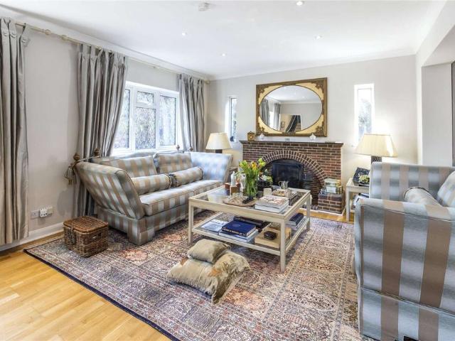 Set within private grounds, this outstanding detached family home offers substantial accommodation, superb entertaining space and a highly versatile layout