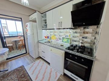 Sevinç'ten Hacı Yusuf'ta Deniz Manzaralı Eşyalı Kiralık 1+1
