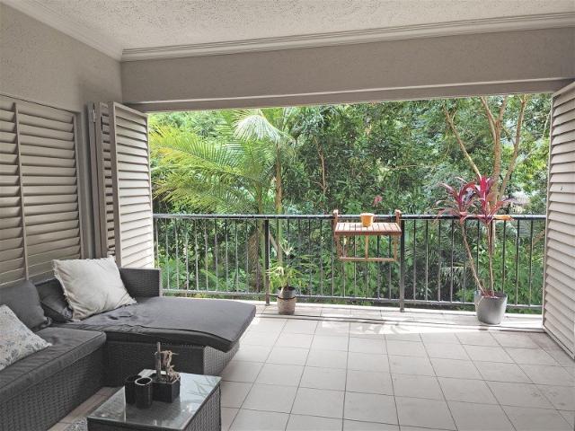 First Floor End Unit Green treed and creekside outlook Private