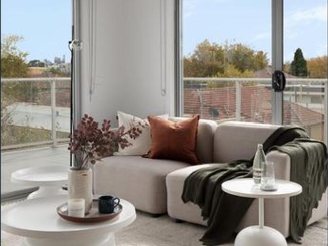 Skyline Views and Sun Drenched Top Floor Living!