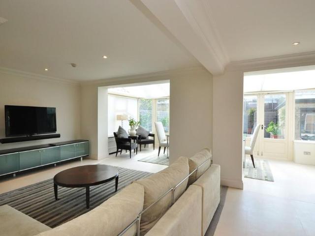 SHORT LET* An impeccably, interior designed apartment with a garage and private garden