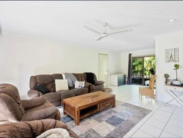 Single level 3 bedroom Ashmore villa with private yard & shared pool