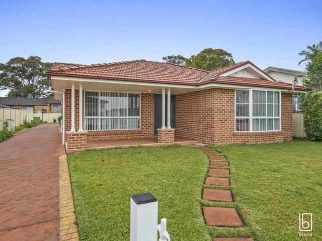 Single Level Coastal Charm with Oversized Garage & Side Access