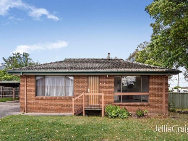 Single level brick classic with a spacious private backyard