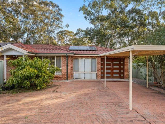 Single Level Brick Home with Expansive Entertaining Deck