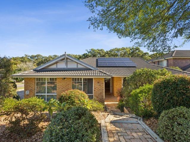 Single level brick home with pool and open interiors