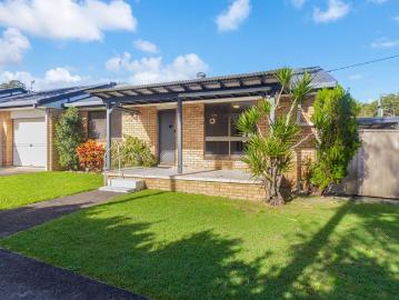 Single Level Duplex with Renovated Kitchen and Large Fenced Yard