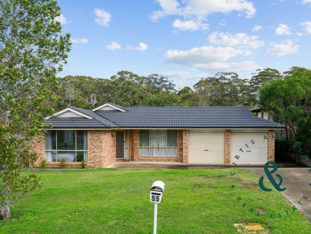 Single level ease with north facing backyard, stroll to parks and school