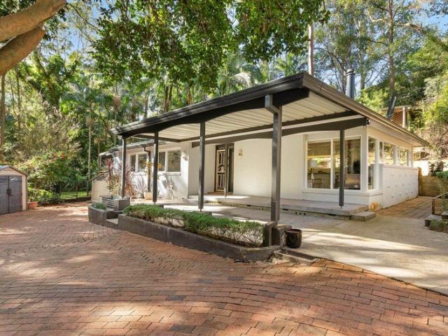 Single level ease wrapped in rainforest like tranquillity, walking distance to Turramurra Public School