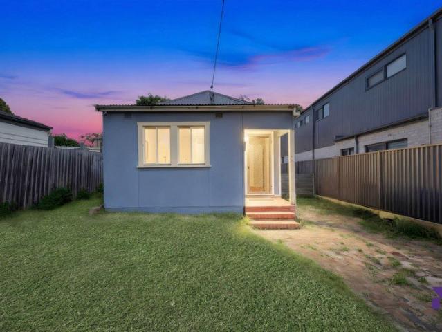 Single level family home holds potential just 650m from Belmore Station and shops