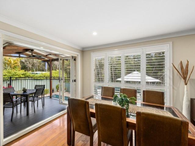 Single level home with in ground pool pairs comfortable everyday living