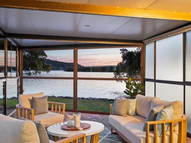 Single level waterfront home in blue ribbon location
