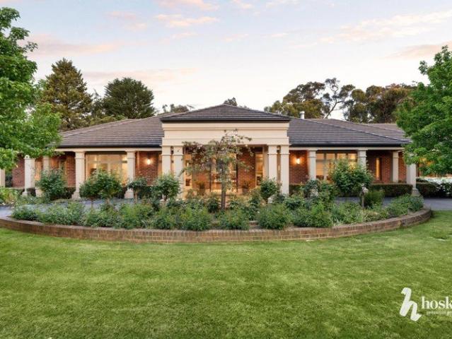 Single Level Timeless Living on a Private, Prized Acre