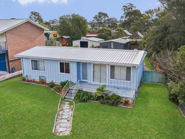 SIDE ACCESS, MODERN UPDATES & EXCEPTIONAL SHED SPACE