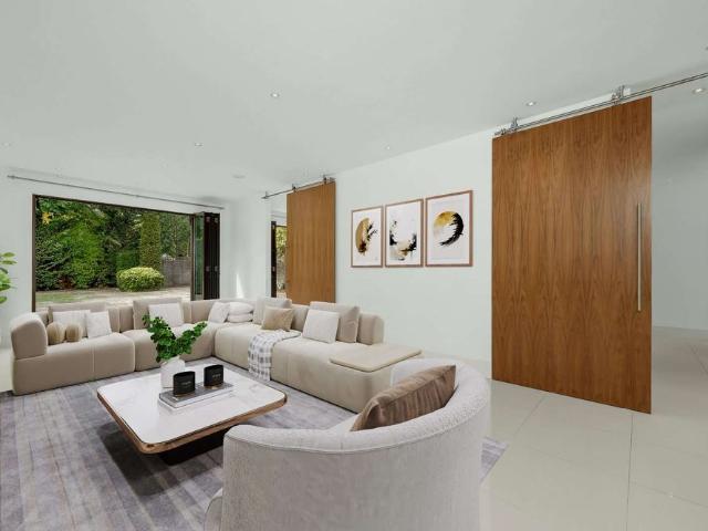 Situated within a quiet gated development just off Esher High Street, this impressive six bedroom semi detached family home is arranged over three floors