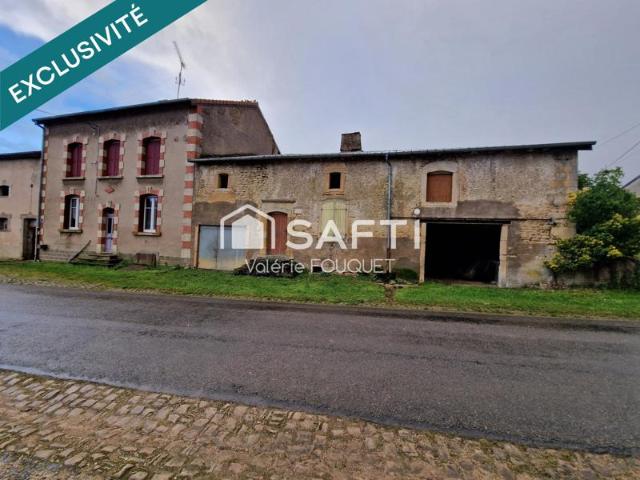 Situé à Vaudoncourt bel ensemble immobilier de caractère avec dépendances sur grand terrain