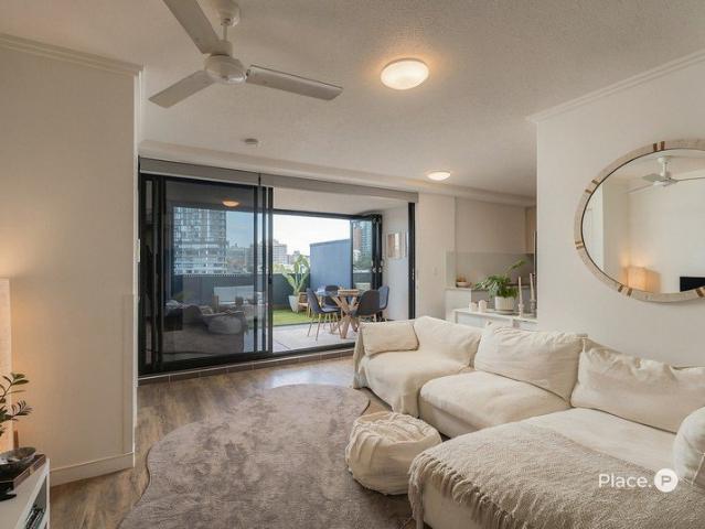 Sixth Floor Sanctuary with Private Courtyard and Rooftop Entertaining