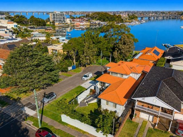 Six Bedroom Tri Level Home with Dual Living and Water Views