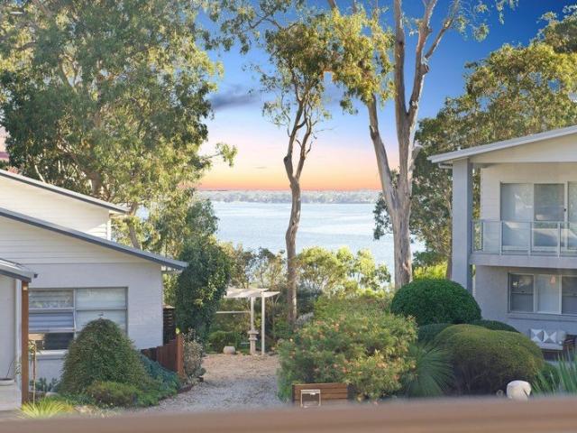 Some Homes Look Towards The Water. This One Lives With It