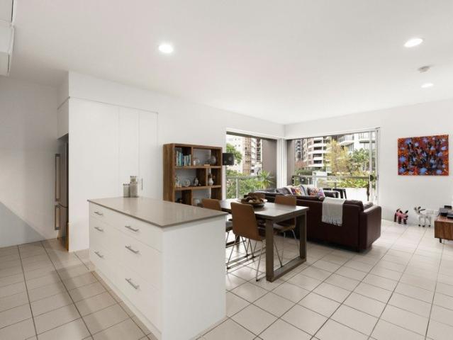 Soaring Ceilings, Designer Finishes & a Top Floor Teneriffe Lifestyle