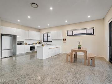 Soaring Ceilings. Polished Concrete. Big, Bold Living