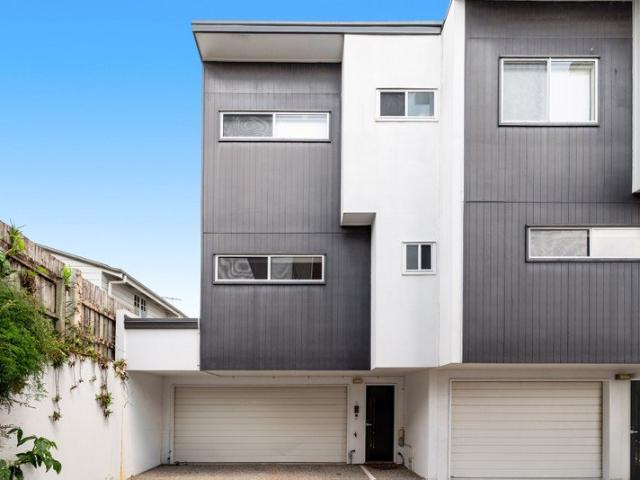Soaring tri level sanctuary immersed among the best of Morningside & Hawthorne