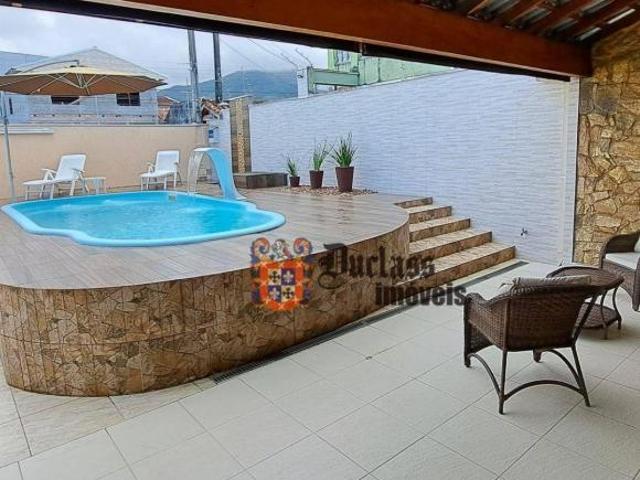 Sobrado com 4 dormitórios à venda, 246 m² por R$ 1.200.000,00 Jardim Aruan Caraguatatuba/SP
